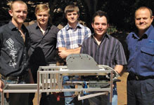 The TUT team with the high-speed automated seeding machine.